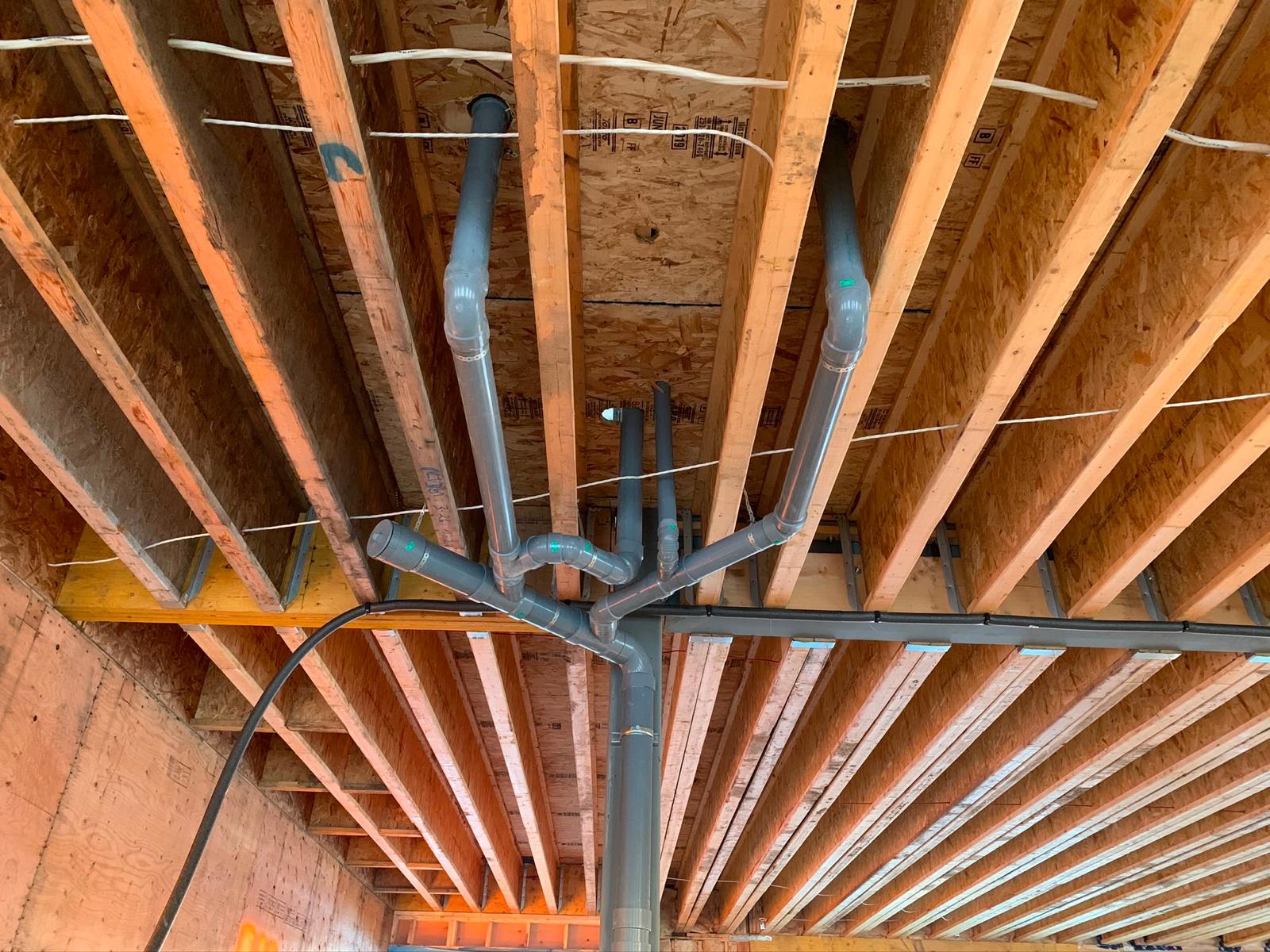 Plumbing rough-in overhead pipe work